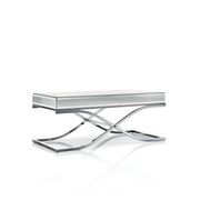 Left angled view of contemporary glam chrome finish steel and mirror coffee table on white background.