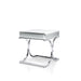 Right angled view of contemporary glam chrome finish steel and mirror end table on white background.