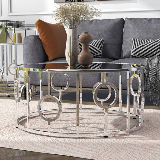 Angled contemporary chrome and mirror coffee table in a living room with accessories