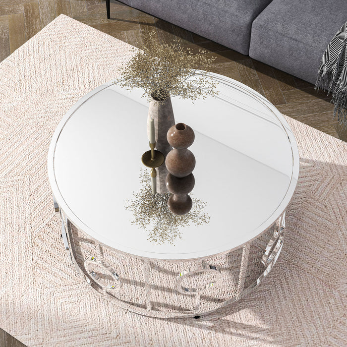 Front facing top view of a contemporary chrome and mirror coffee table in a living room with accessories
