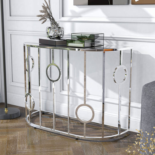 Left angled contemporary chrome and mirror console table in a living room with accessories