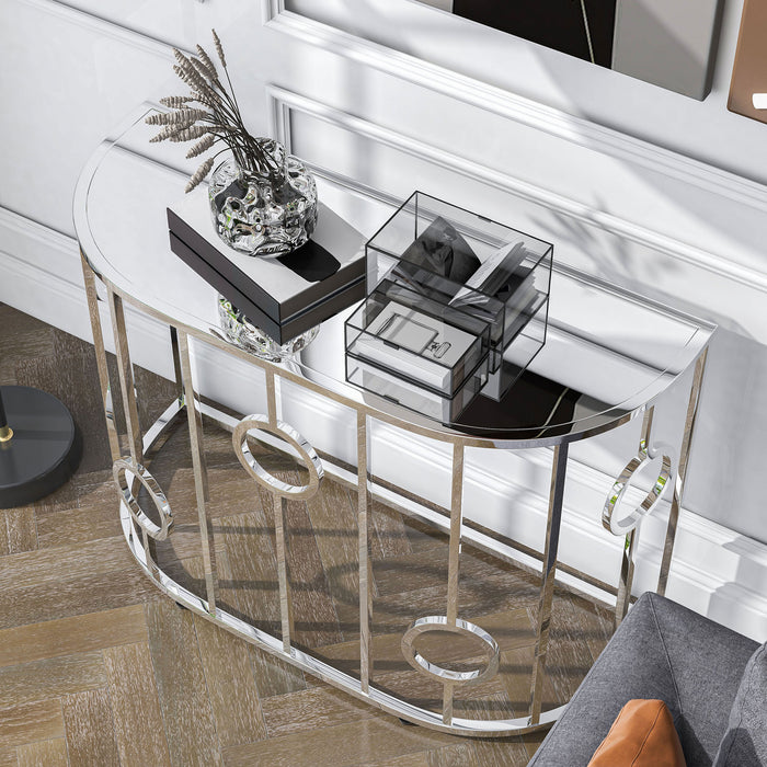 Left angled top view of a contemporary chrome and mirror console table in a living room with accessories