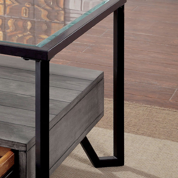 Left angled close up of black metal frame and lower shelf of industrial coffee table in a living room. Smooth glass top and spacious lower plank style shelf.