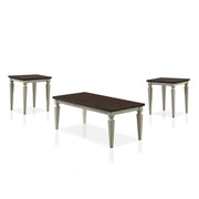 Semi-side facing view of transitional three-piece antique white and brown finish wood coffee table set on a white background