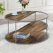Elevated semi-front facing view of contemporary round gray finish steel and wood three-level coffee table in a living room with accessories