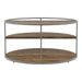Side-facing view of contemporary round gray steel and wood three-level coffee table on a white background