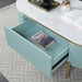Top-down glam light teal fluted coffee table with rounded faux white marble top and gold accents with open flush drawer to reveal extra storage in a living room.