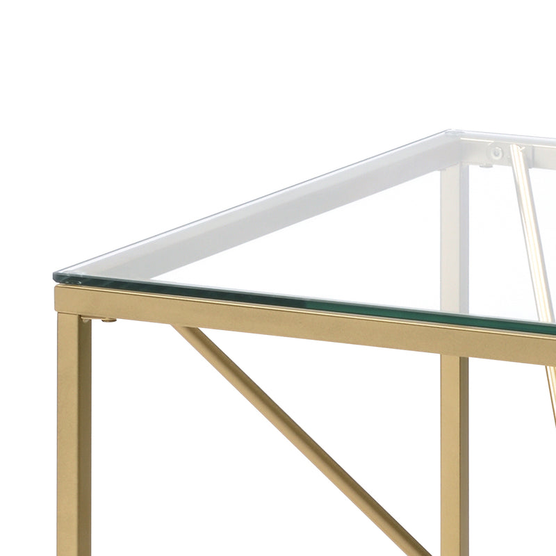 Left angled close up corner detail on a glam gold and glass square end table on a white background