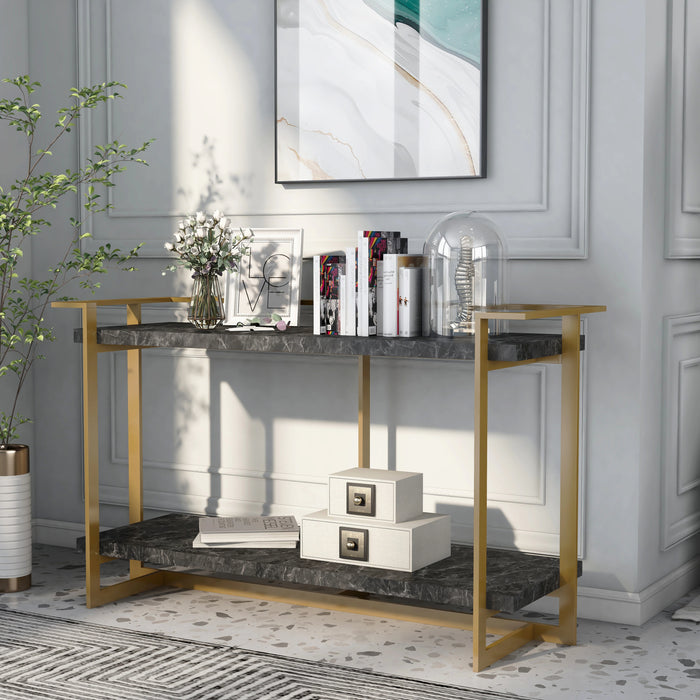 Left angled modern glam gold and faux marble console table in a living room with accessories