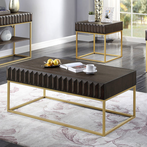 Left angled contemporary walnut gold coffee table and end table with decorative accessories in a living room setting. Slim gold steel base and geometric texture wood drawer fronts offer extra attention to detail.