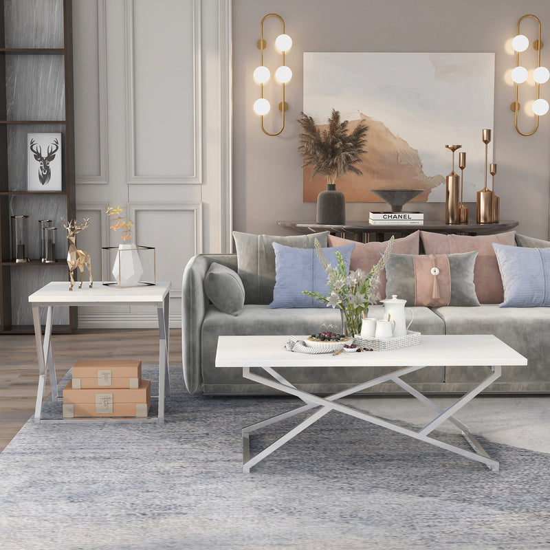 Front-facing glam two-piece chrome and white geometric coffee table set in a living room with accessories