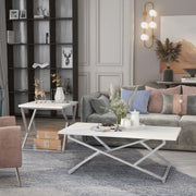 Left angled glam two-piece chrome and white geometric coffee table set in a living room with accessories