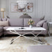  Front-facing glam chrome and white geometric coffee table in a living room with accessories
