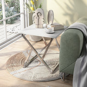 Left angled contemporary chrome and high gloss white end table in a living room with accessories