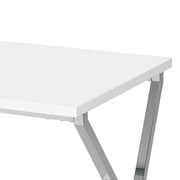 Left angled top corner close up view of a contemporary chrome and high gloss white end table on a white background