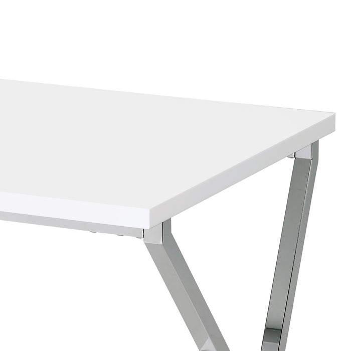 Left angled top corner close up view of a contemporary chrome and high gloss white end table on a white background