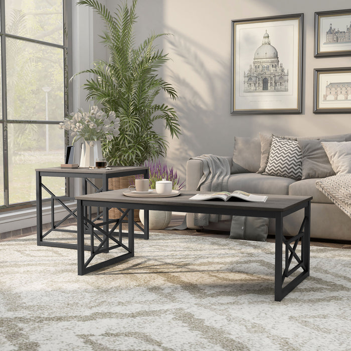 Left angled transitional gray rectangular coffee table and side-facing transitional gray end table with geometric black metal sled bases on a rug in a living room setting.