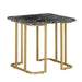 Angled view of contemporary black marble and gold coated steel geometric end table on a white background