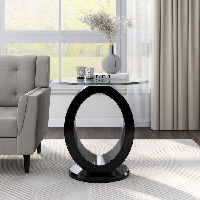Front-facing view of contemporary geometric glossy black and tempered glass top end table in living room with accessories