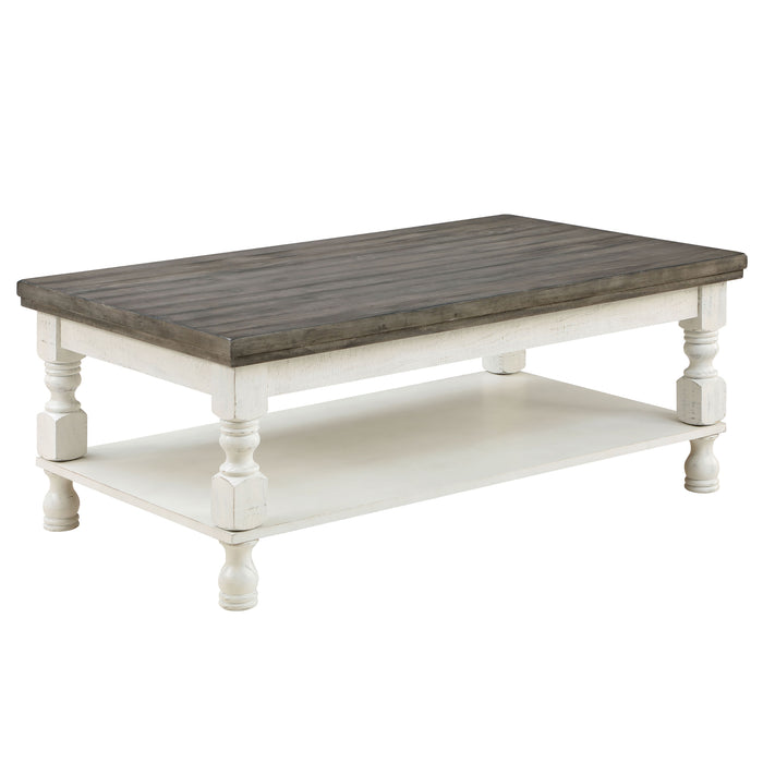 Right angled rustic gray wood coffee table with antique white open shelf base on a white background. 