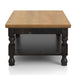 Side-facing rustic antique black wood coffee table with oak tabletop and open lower shelf on a white background.