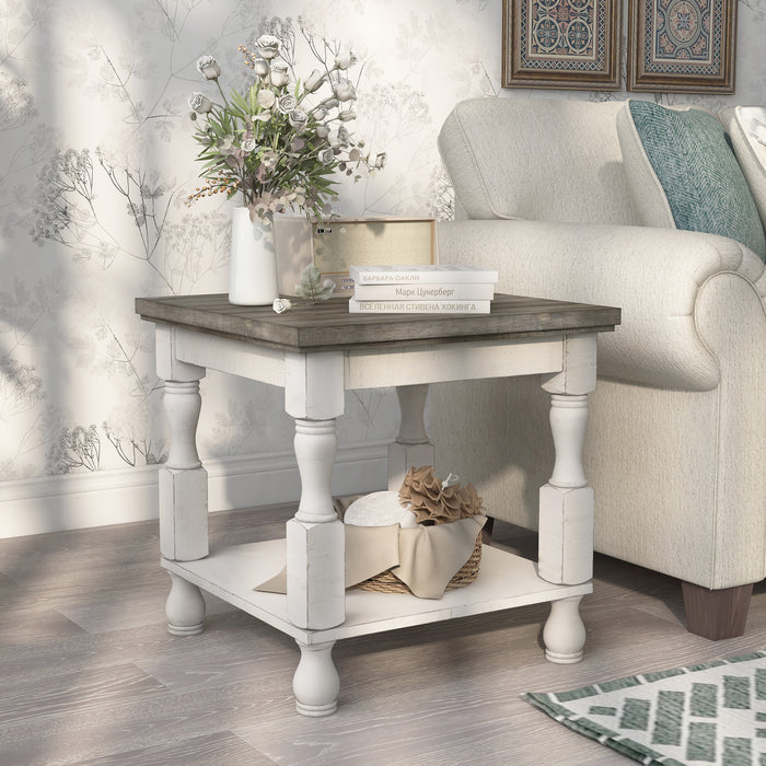 Right angled transitional one-shelf antique white and gray wood end table in a living room with accessories