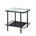 Left angled modern industrial black steel end table with tempered white marble glass top and perforated open metal shelves on a white background.
