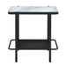 Side-facing modern industrial black steel end table with tempered white marble glass top, slender steel legs and perforated open metal shelf on a white background.