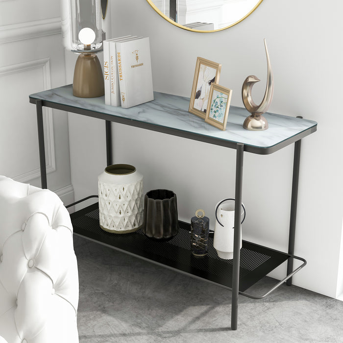 Left angled modern industrial black steel console table with tempered white marble glass top, perforated open metal shelf, and slim legs under mirror against a wall.