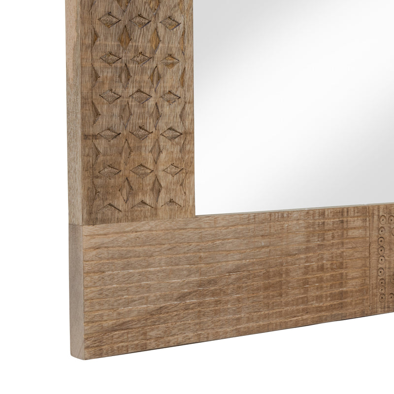 Close-up partial view of bottom left edge of detail on natural finish mango wood framed rectangular decorative mirror on white background