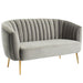 Right-angled modern glam shell tufted loveseat with light gray upholstery and gold finish legs on a white background