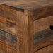 Right angled close up upper front corner detail from a rustic natural mango wood five-drawer accent chest
