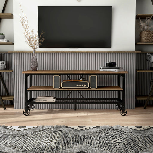 Front-facing tobiah industrial TV stand in a living room with accessories