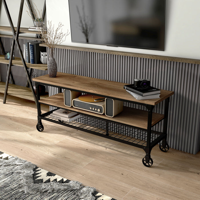 Left angled view of tobiah industrial TV stand in a living room with accessories