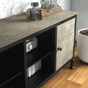 Left-angled close up modern industrial TV stand door and leg detail in a living room