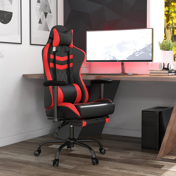 Angled view of contemporary red and black faux leather and metal gaming chair in work space with furnishings and accessories