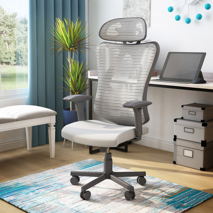 Left angled contemporary gray office chair with mesh and a headrest in a home office with accessories