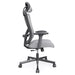 Front facing side view of a contemporary gray office chair with mesh and a headrest on a white background