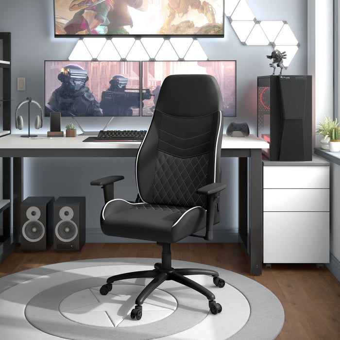 Angled view of modern black and white faux leather and strong iron adjustable gaming chair in work space with furnishings and accessories