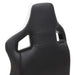 Right angled close up modern black and white faux leather gaming chair upper backrest detail on a white background