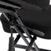 Right angled close up modern black ergonomic kneeling chair with wheels seat and adjustment detail on a white background