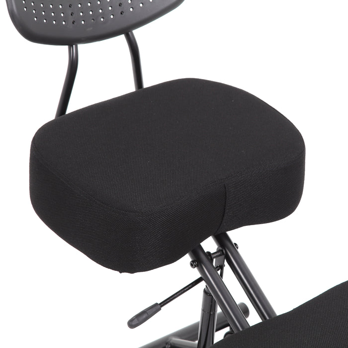 Right angled close up modern black ergonomic kneeling chair seat cushion detail on a white background