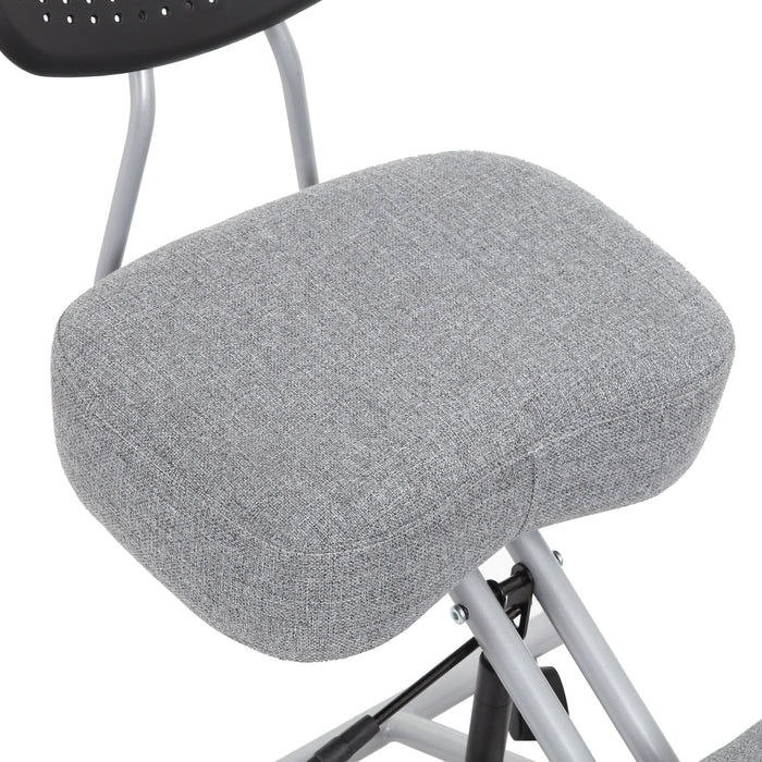 Right angled close up modern light gray ergonomic kneeling chair seat cushion detail on a white background