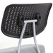 Right angled close up modern light gray ergonomic kneeling chair perforated seat back detail on a white background