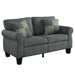 Right angled dark gray loveseat with checkered pillows on a white background