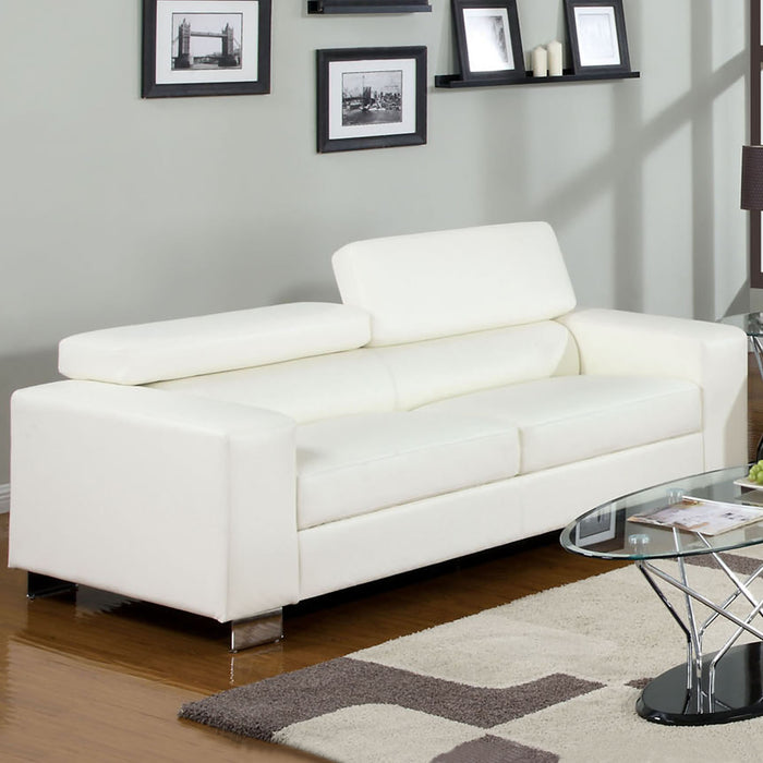 Right angled contemporary white faux leather sofa in living room with accessories.