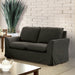 Left-angled transitional loveseat with flared arms and skirted base in a casual living space