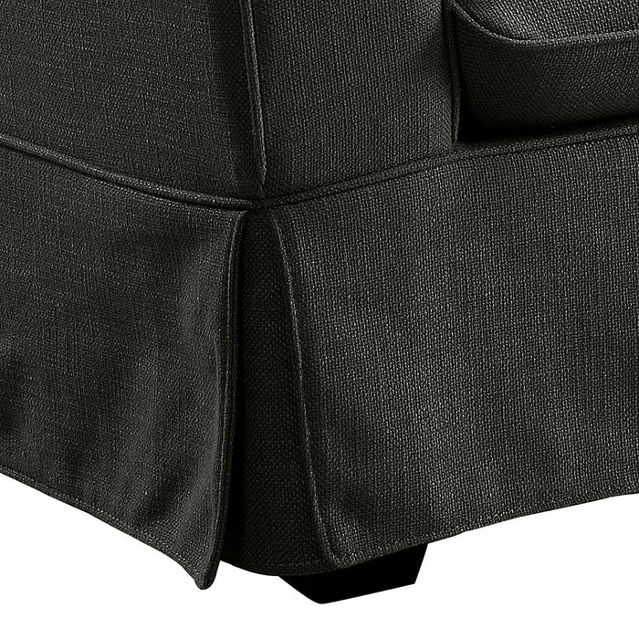Right-angled close up transitional loveseat skirted base and leg detail on a white background
