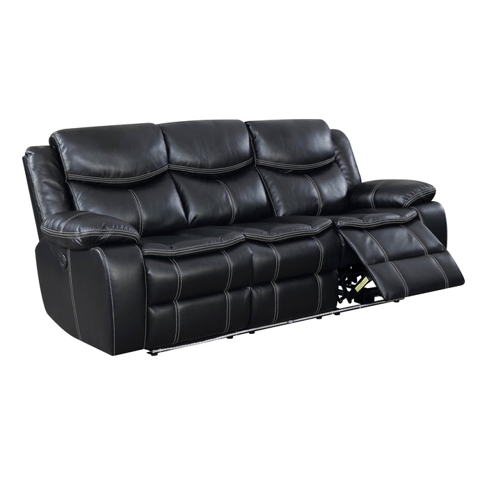 Right facing transitional black faux leather power recliner sofa with contrast stitching on a white background