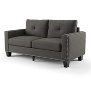 Right angled view of modern gray fabric sofa on white background.